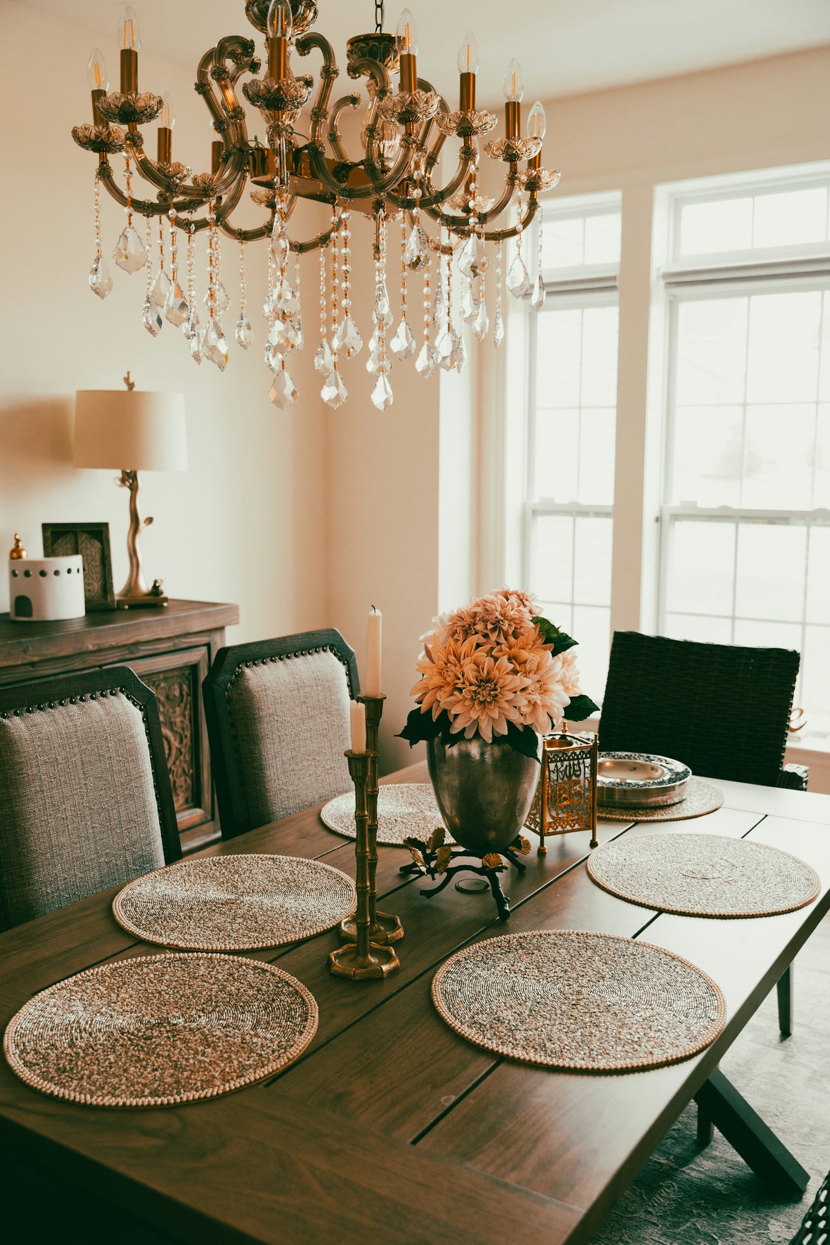 Chandelier hanging over a dining room table